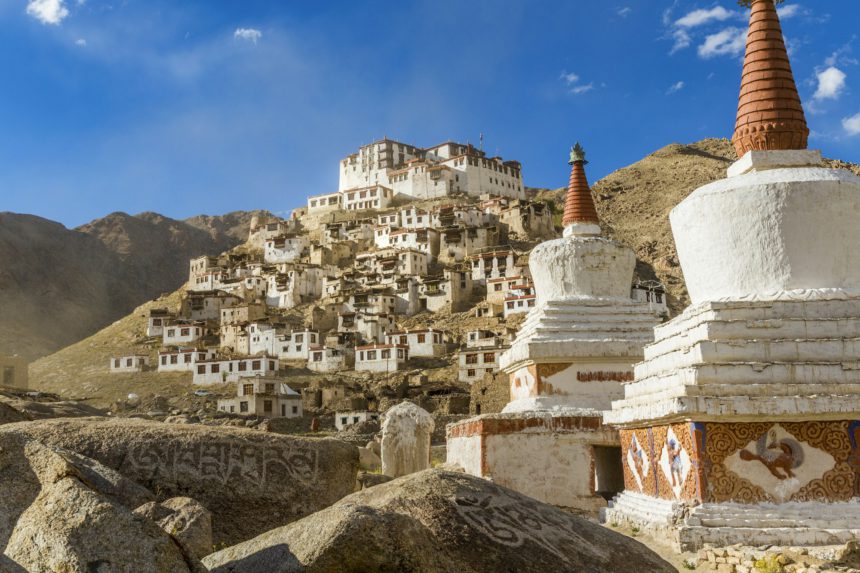 Mountain landscape with Buddhist monastery and stupa of a temple.